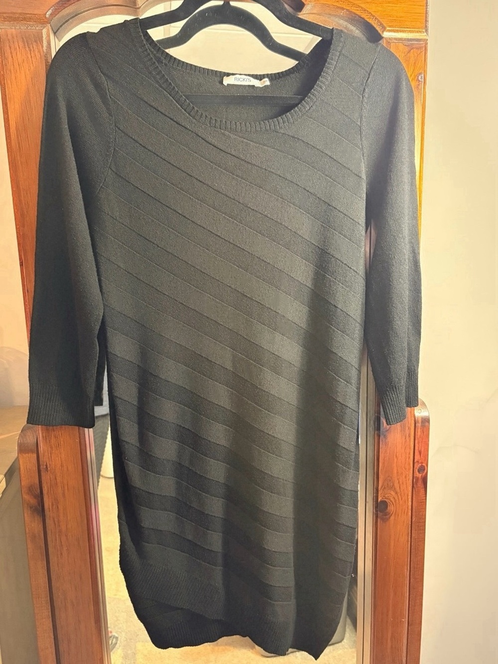 Ricki’s Asymmetrical Three-Quarter Sleeve Knit Sweater in Black